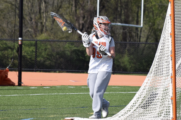 Sophomore Frankie Zilembo moves around the goal looking for a pass to a teammate to clear the ball. Zilembo was also on varsity her freshman year. 
